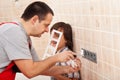 Boy assisting his father in electrician work Royalty Free Stock Photo