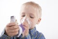 Boy with asthma inhaler Royalty Free Stock Photo