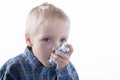 Boy and asthma inhaler Royalty Free Stock Photo