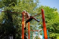 Street workout on a horizontal bar in the school park