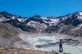 Boy with an athletic figure standing over the drained Finstertal dam near the village of Kuhtai in western Austria, near famous