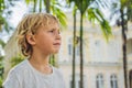 Boy on background of Old Town Hall in George Town in Penang, Malaysia. The foundation stone was laid in 1879