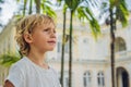 Boy on background of Old Town Hall in George Town in Penang, Malaysia. The foundation stone was laid in 1879