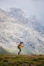 boy with a backpack on a hike against the backdrop of the mountains. child traveler with backpack, hiking, travel, mountains in
