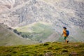 boy with a backpack on a hike against the backdrop of the mountains. child traveler with backpack, hiking, travel, mountains in