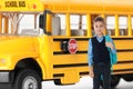 Boy with backpack near school bus. Transport for students Royalty Free Stock Photo