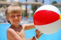 Boy with Ball at Pool Royalty Free Stock Photo