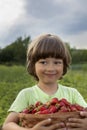 Boy with basket of berries Royalty Free Stock Photo