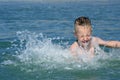 Boy bathes in the sea. Royalty Free Stock Photo