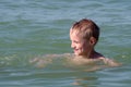 Boy bathes in the sea. Royalty Free Stock Photo