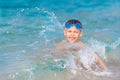 Boy bathes on sea water Royalty Free Stock Photo