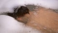 Boy Bathes in Water with Foam in Bathtub, Submerges Under Water, Blows Bubbles