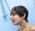 Boy bathing under a shower Royalty Free Stock Photo