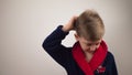 boy in a bathrobe posing at the camera on a white background Royalty Free Stock Photo