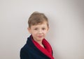 boy in a bathrobe posing at the camera on a white background Royalty Free Stock Photo