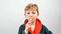 boy in a bathrobe posing at the camera on a white background Royalty Free Stock Photo