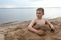 Boy on beach of Lake Seliger Royalty Free Stock Photo