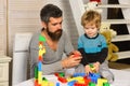 Boy and bearded man play together. Father and son Royalty Free Stock Photo