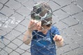Boy behind bars Royalty Free Stock Photo