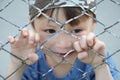 Boy behind bars Royalty Free Stock Photo
