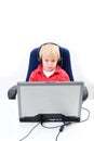 Boy behind a laptop Royalty Free Stock Photo