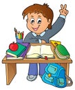 Boy behind school desk theme image 1 Royalty Free Stock Photo