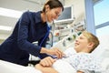 Boy Being Examined By Female Consultant In Emergency Room Royalty Free Stock Photo