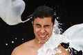 Boy being splashed by milk