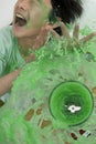 Boy being splashed by overflowing blender