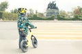 A boy with a bicycle crosses a pedestrian crossing with yellow markings Royalty Free Stock Photo