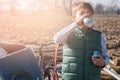 boy with bicycle drinks water on a sunny day