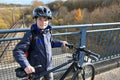 Boy with bicycle and helmet