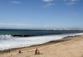 Boy with bicycle on Mexican beach.