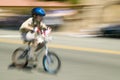 Boy bicycle rider makes his way down main street during a Fourth of July parade in Ojai, CA Royalty Free Stock Photo