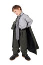 Boy in big man's suit and boots dressing jacket Royalty Free Stock Photo