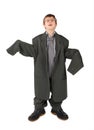 Boy in big man's suit, boots and glasses floor