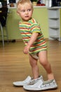 Boy in big shoes Royalty Free Stock Photo