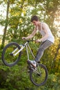 Boy on bike make the bunny hop trick Royalty Free Stock Photo