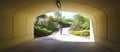 A Boy on a Bike Rides Toward a Tunnel