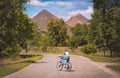 Boy on a bike on a road against slagheap Royalty Free Stock Photo