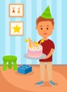 Boy in Birthday Hat Holding Cake in Kids Room.