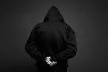 Boy in Black Hood. Back of arrested hooded man Royalty Free Stock Photo