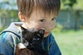 Boy with black kitten