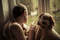 Boy with Blanket and Toy Sitting in Window Sill Royalty Free Stock Photo