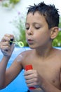 Boy blowing bubbles Royalty Free Stock Photo