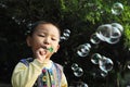 Boy blowing bubbles