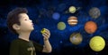 Boy Blowing Bubbles, Planets, Stars Royalty Free Stock Photo