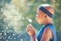 Boy, blowing a dandelion and making a wish with a black child outside on a basketball court while holding a magical Royalty Free Stock Photo