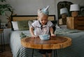 Boy blowing out a candle on a birthday cake Royalty Free Stock Photo