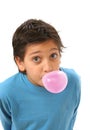 Boy blowing a pink bubble gum Royalty Free Stock Photo